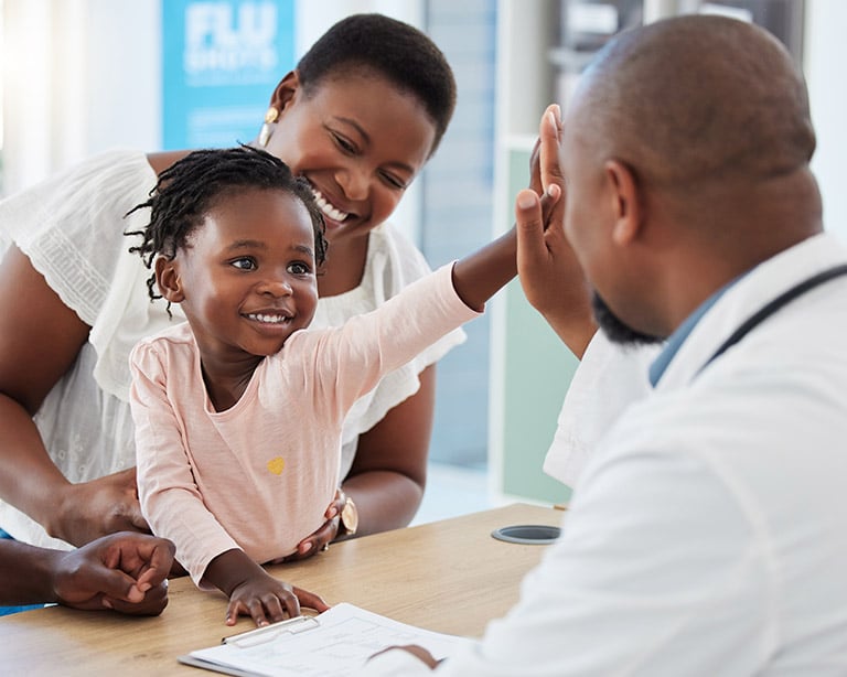 Girl High Fiving a Doctor