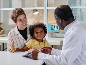 Child and Mom Talking With a Doctor